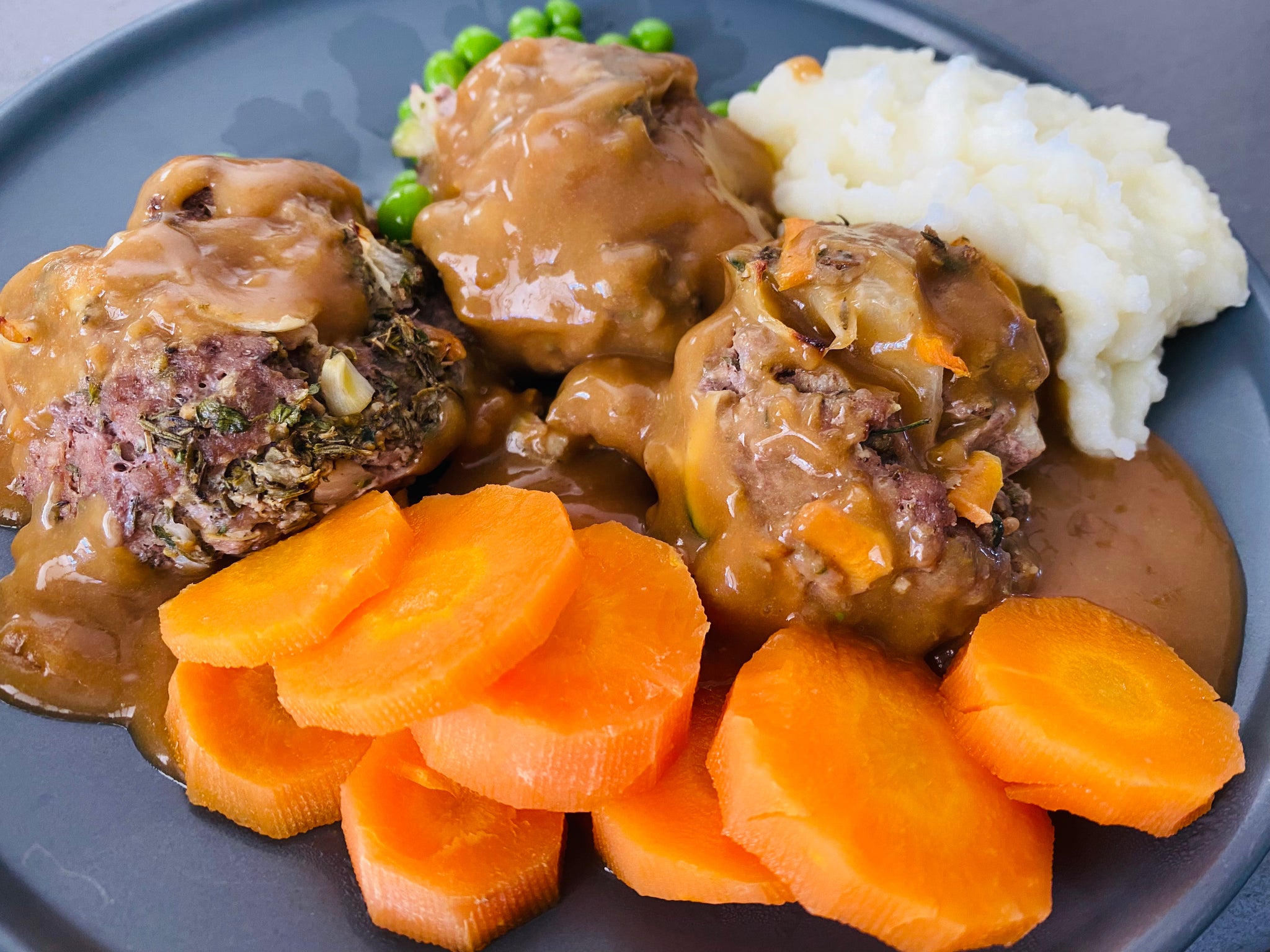 Rissoles with gravy, mash and veg